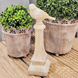 Dekovogel Valo auf Säule creme/grau